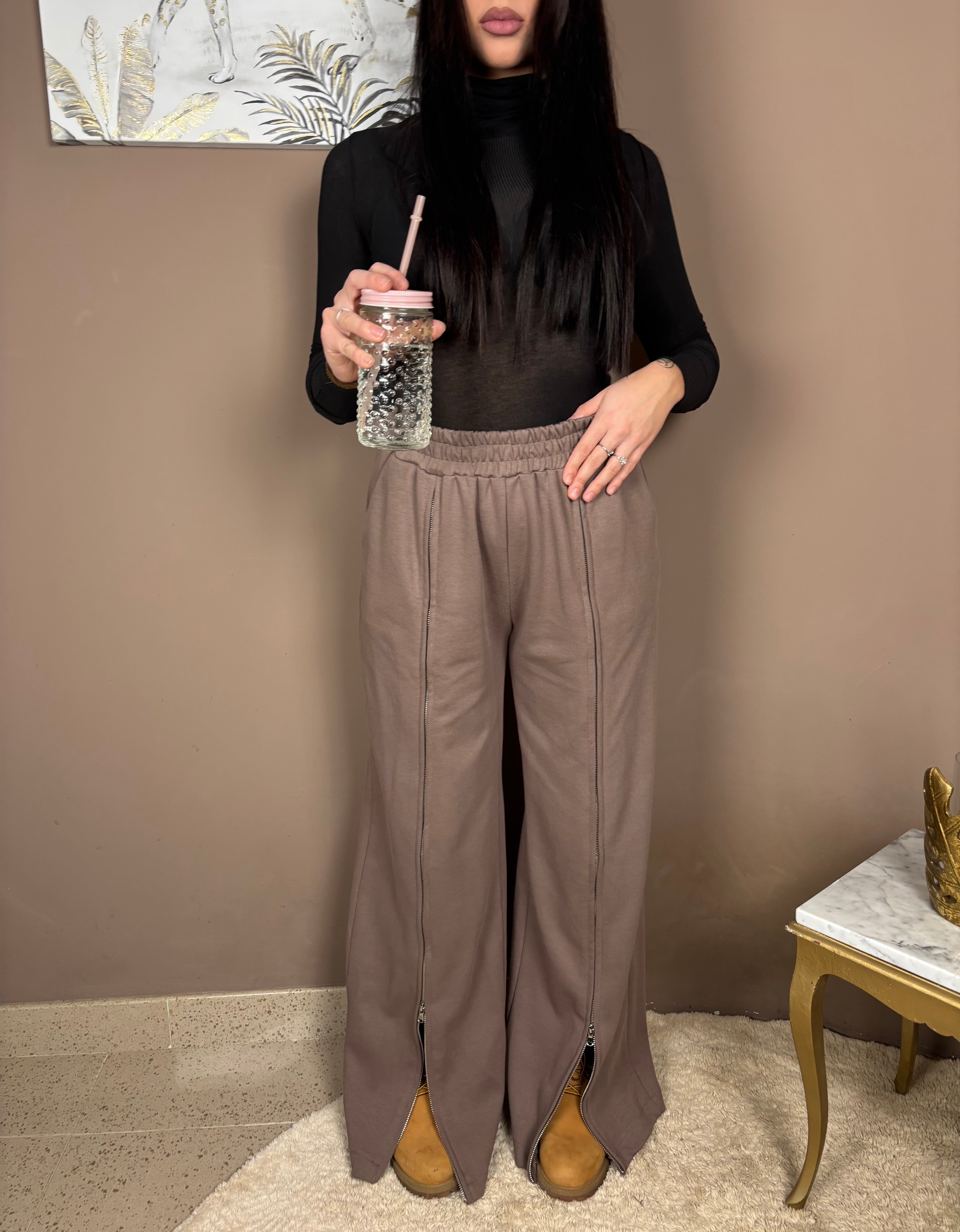 Pantaloni con cerniera